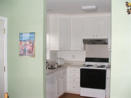 Small Efficient Kitchen next to dining area