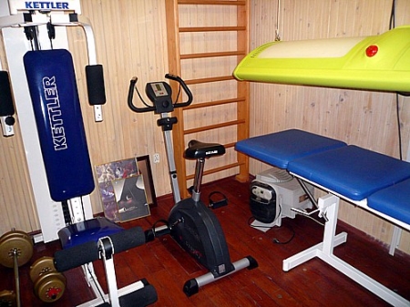 fitness room with solarium and masage bed